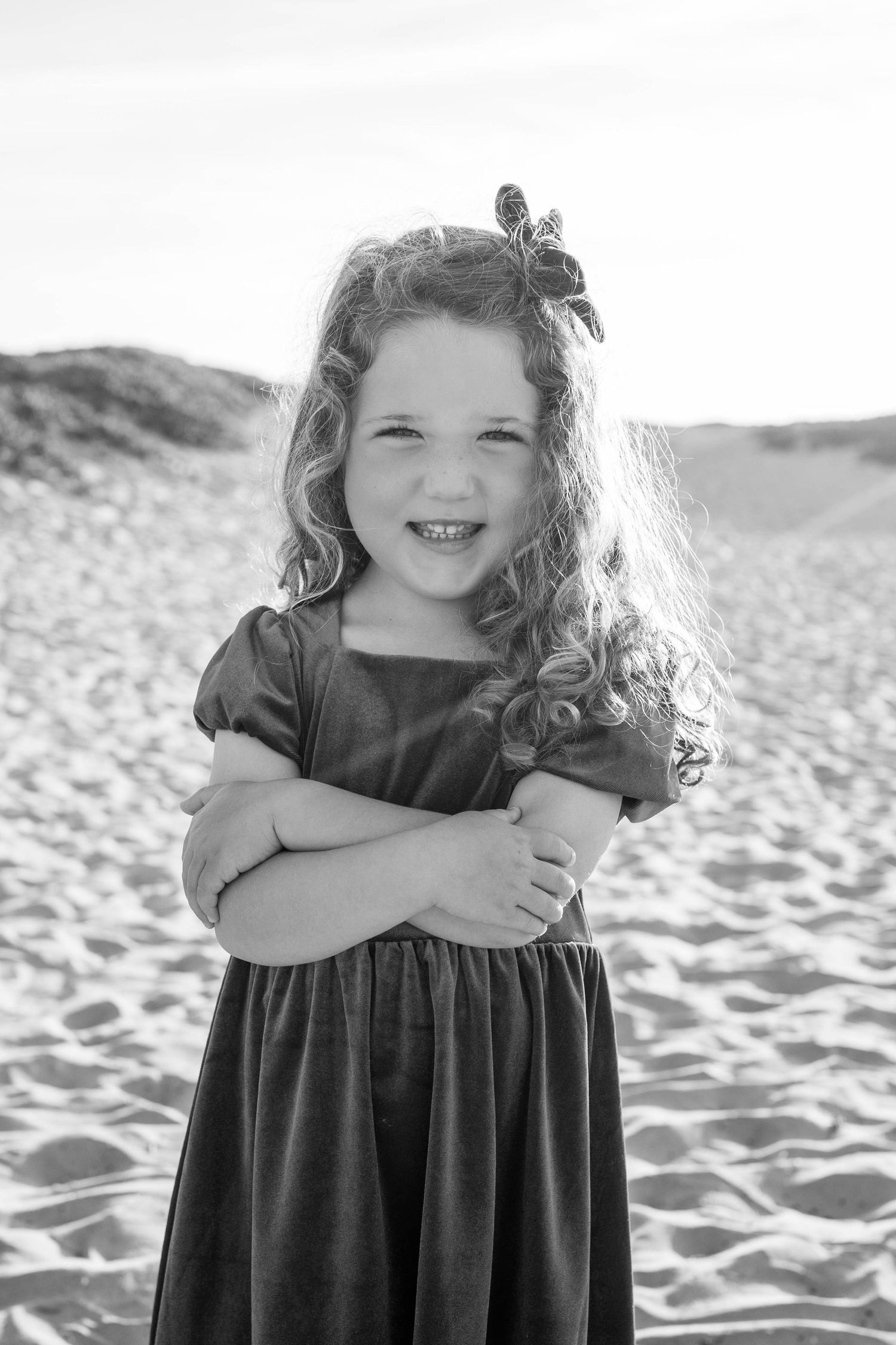 Full of spark and softness. A classic beach portrait session that captures her bold spirit and sweet in-between moments.