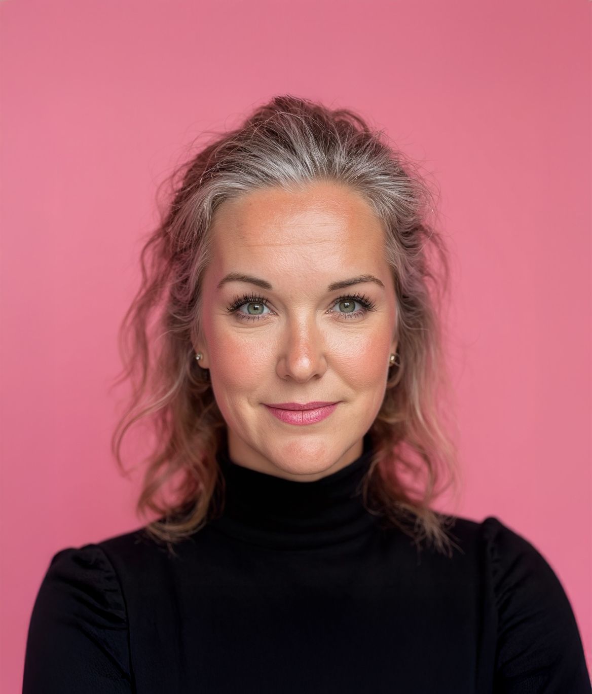 Lauren Wilson, San Diego brand strategist and photographer, portrait in black turtleneck on pink background for Dolce Vita Studio.
