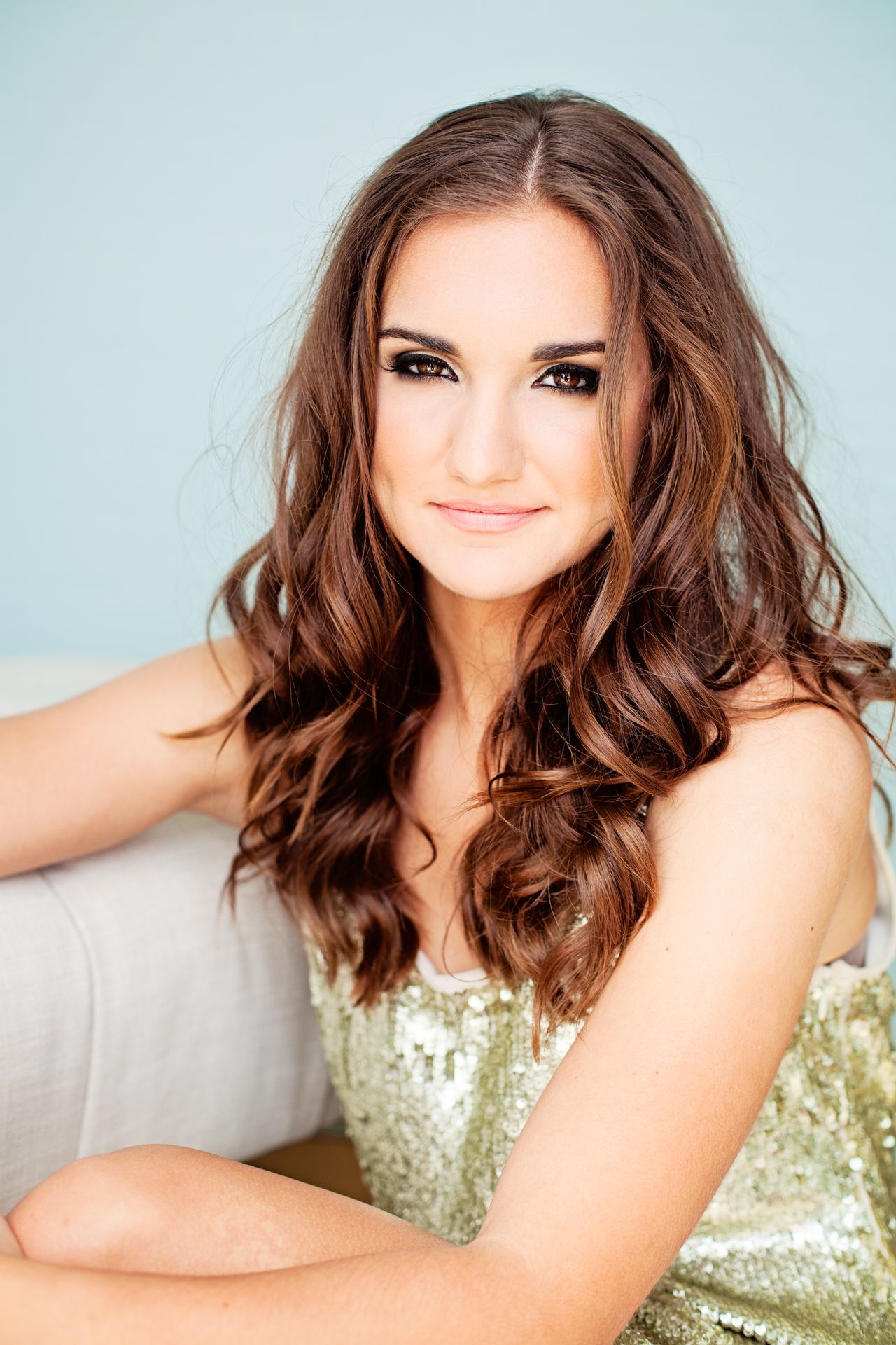 Professional headshot for an actress in a gold sequin dress