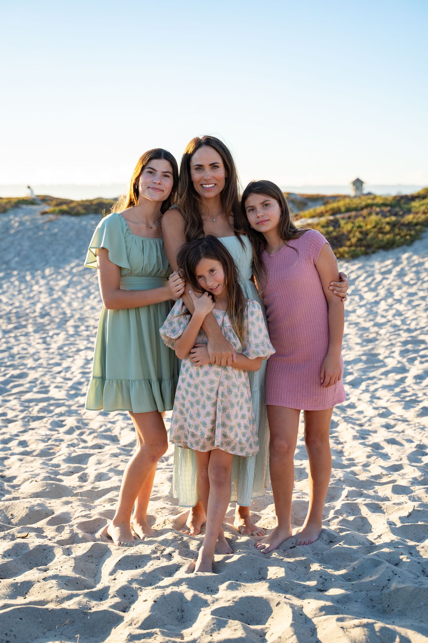 San Diego family photography on the beach—natural light portrait of mom with three daughters by Dolce Vita Studio.