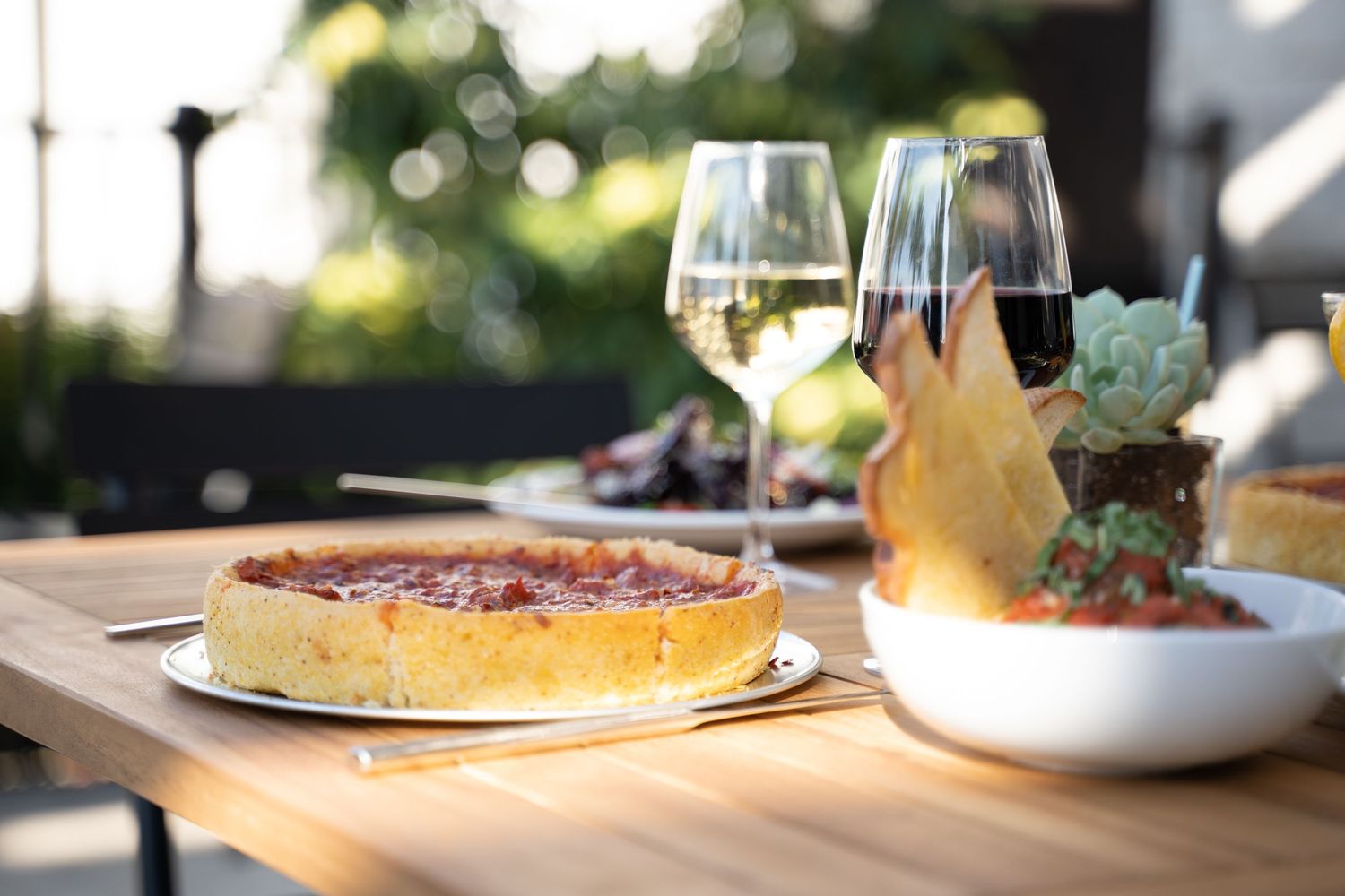 Chicago-style deep dish pizza with bubbling cheese, rich tomato sauce, and crispy golden crust – comfort food recipe photo