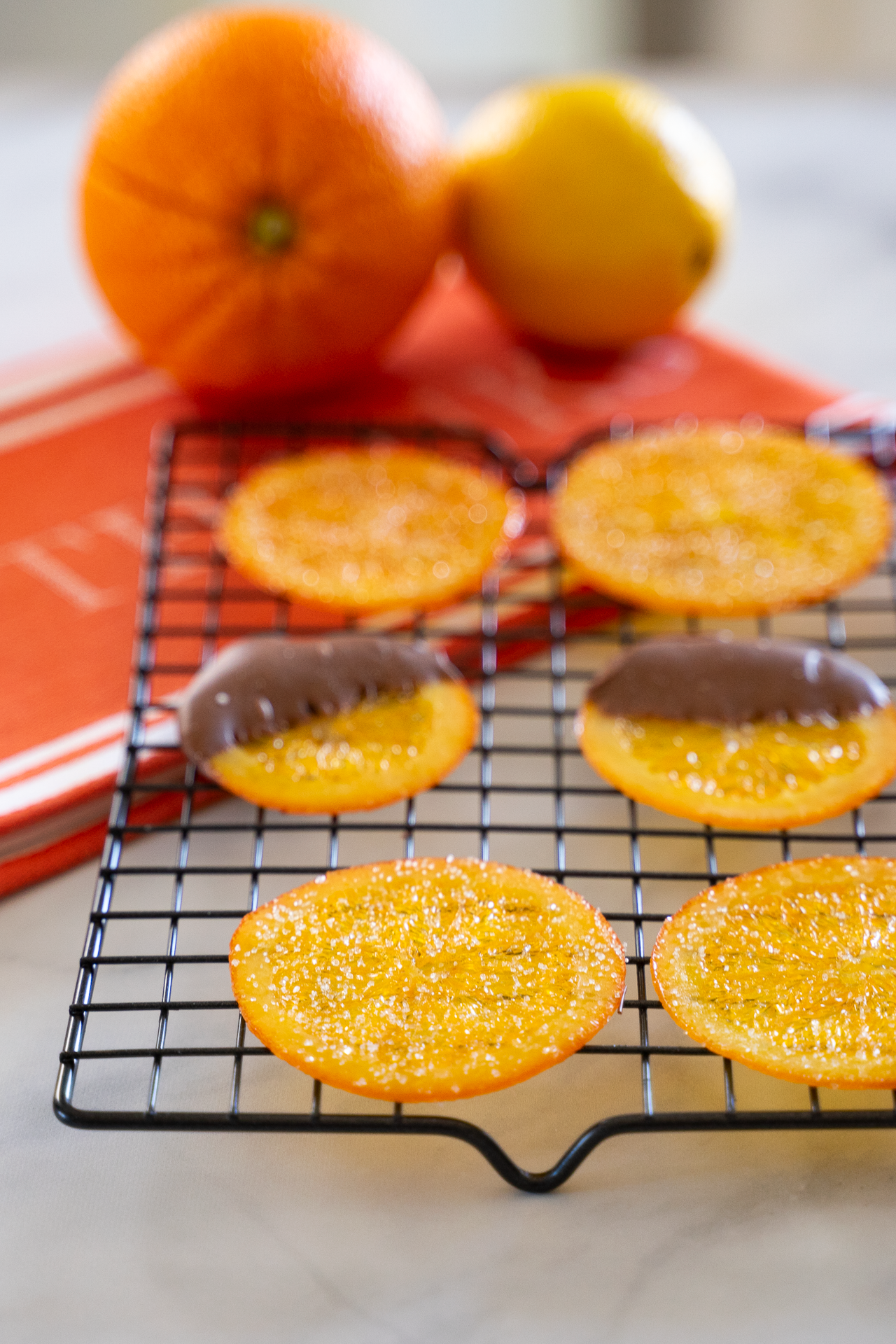 Bright and glossy candied oranges with crystallized edges – styled photo for gourmet dessert prep