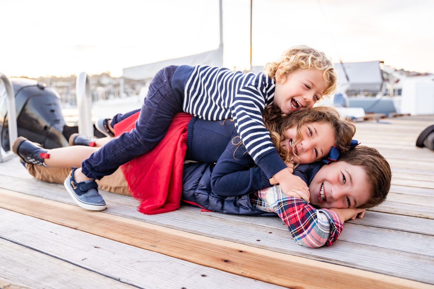 San Diego lifestyle photographer captures playful kids portrait with natural light, real expressions, and personality-driven photography.