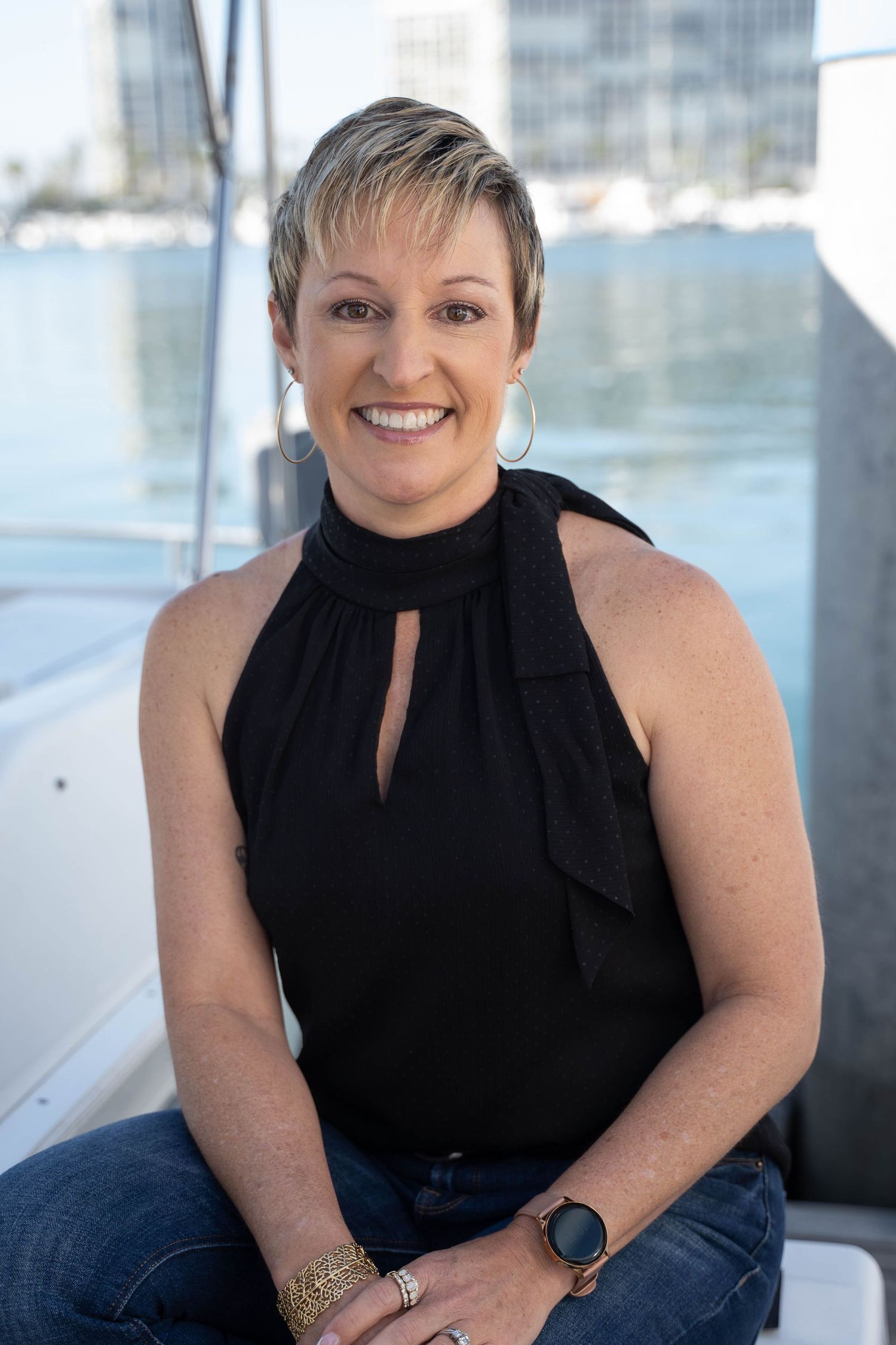 Professional portrait with subtle nautical elements and soft shoreline backdrop – taken in San Diego
