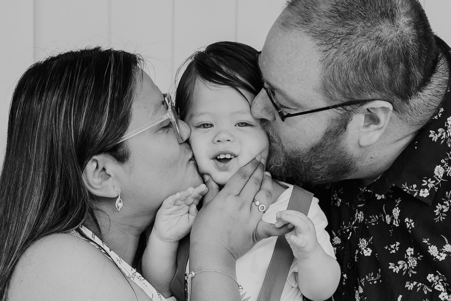 Series of intimate black and white portraits showing emotional expressions.