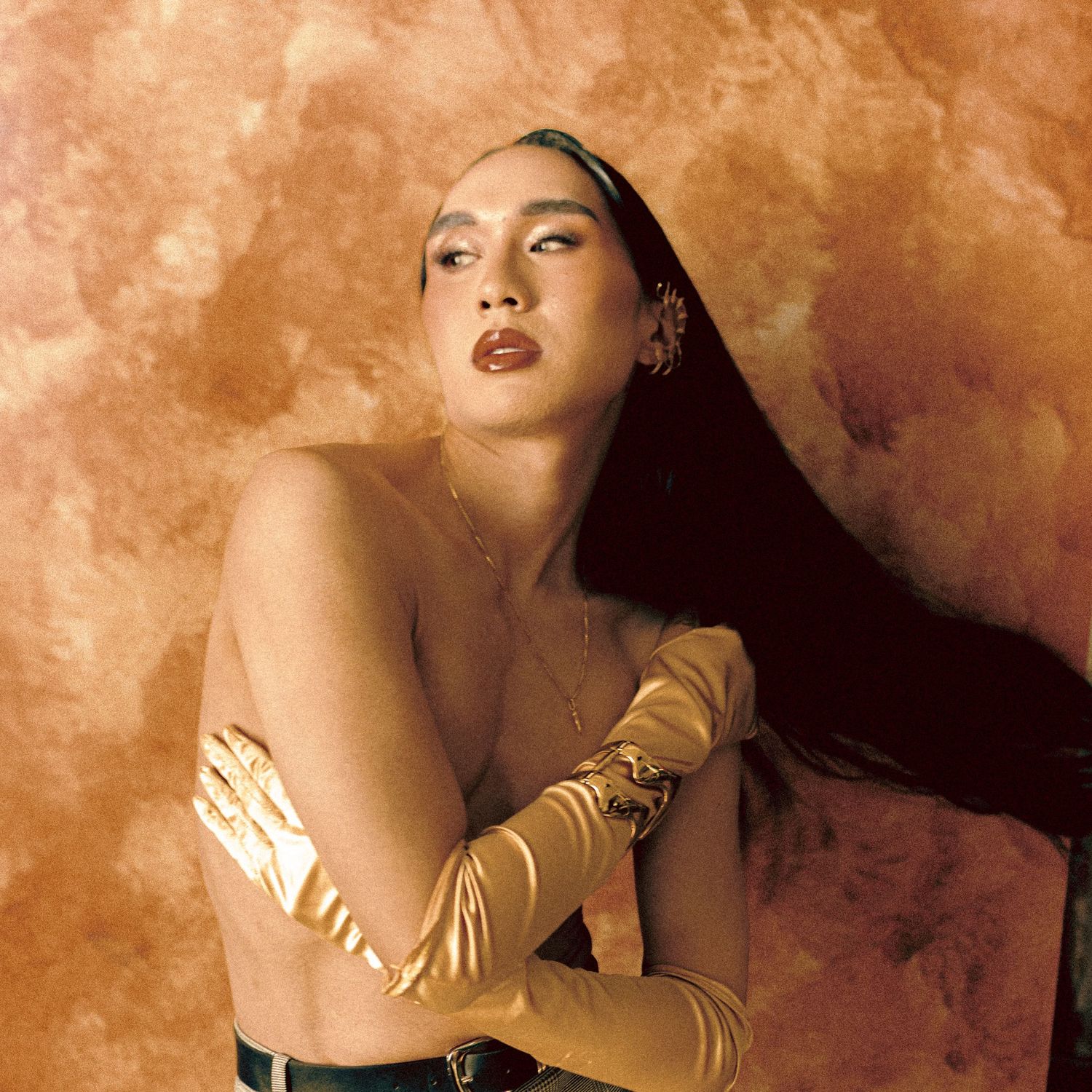 Portrait of Rejh, a non-binary person, photographed ant Coin 8 studio in Toronto.