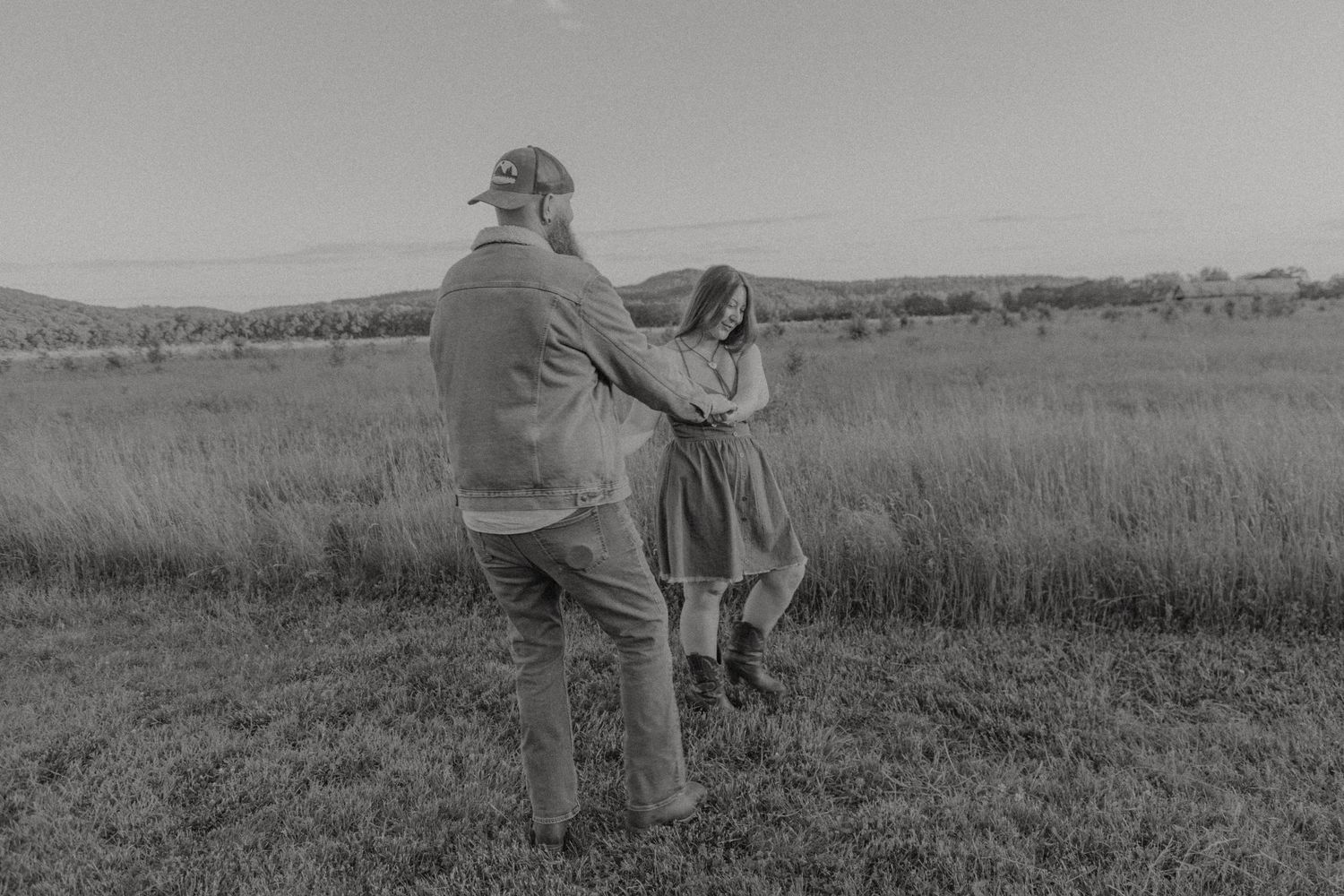 Ohio wedding photographer - Adeva Rae Photography - CoupleOhio wedding photographer - Adeva Rae Photog in field with hills - western attire.