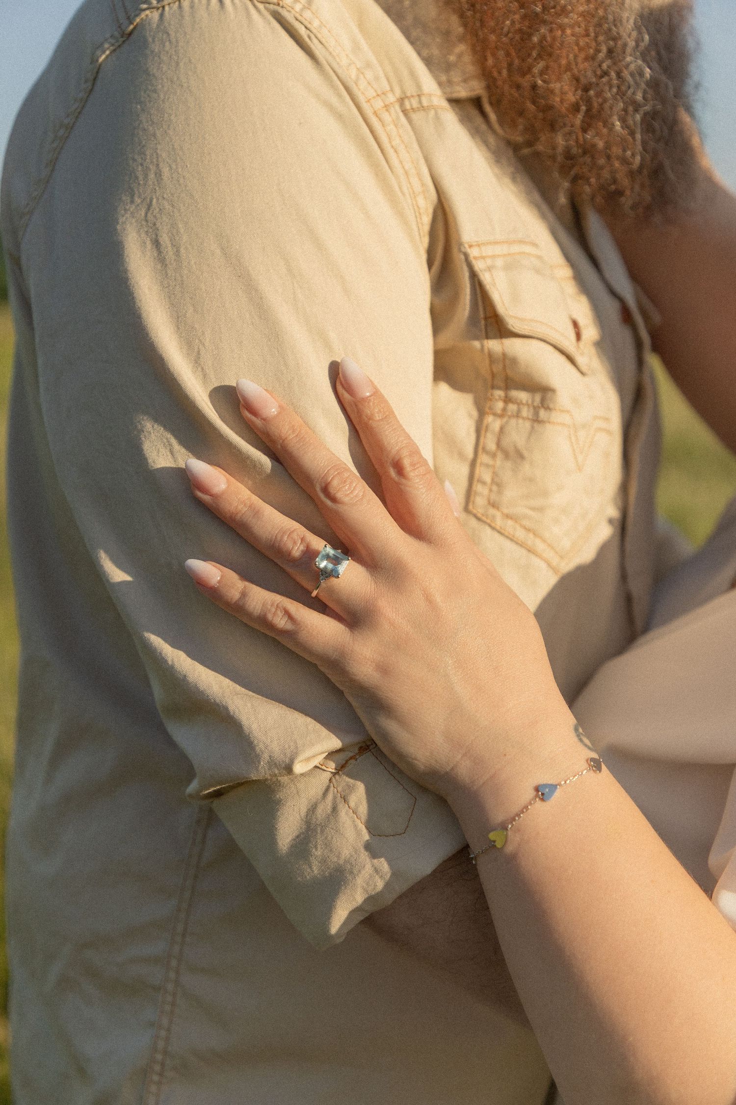 Ohio wedding photographer - Adeva Rae Photography - Couple in field with hills - western attire.