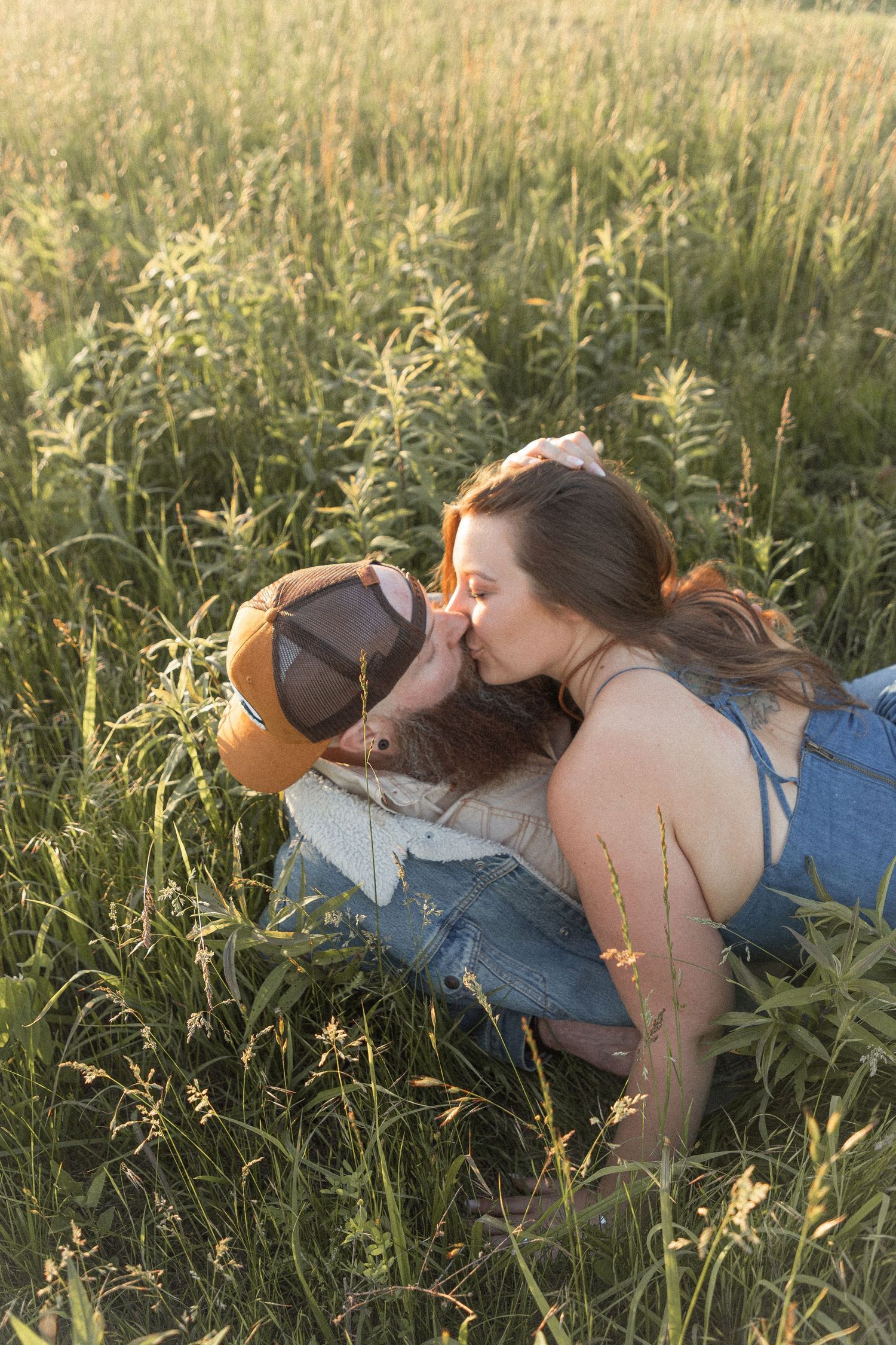 Ohio wedding photographer - Adeva Rae Photography - Couple in field with hills - western attire.