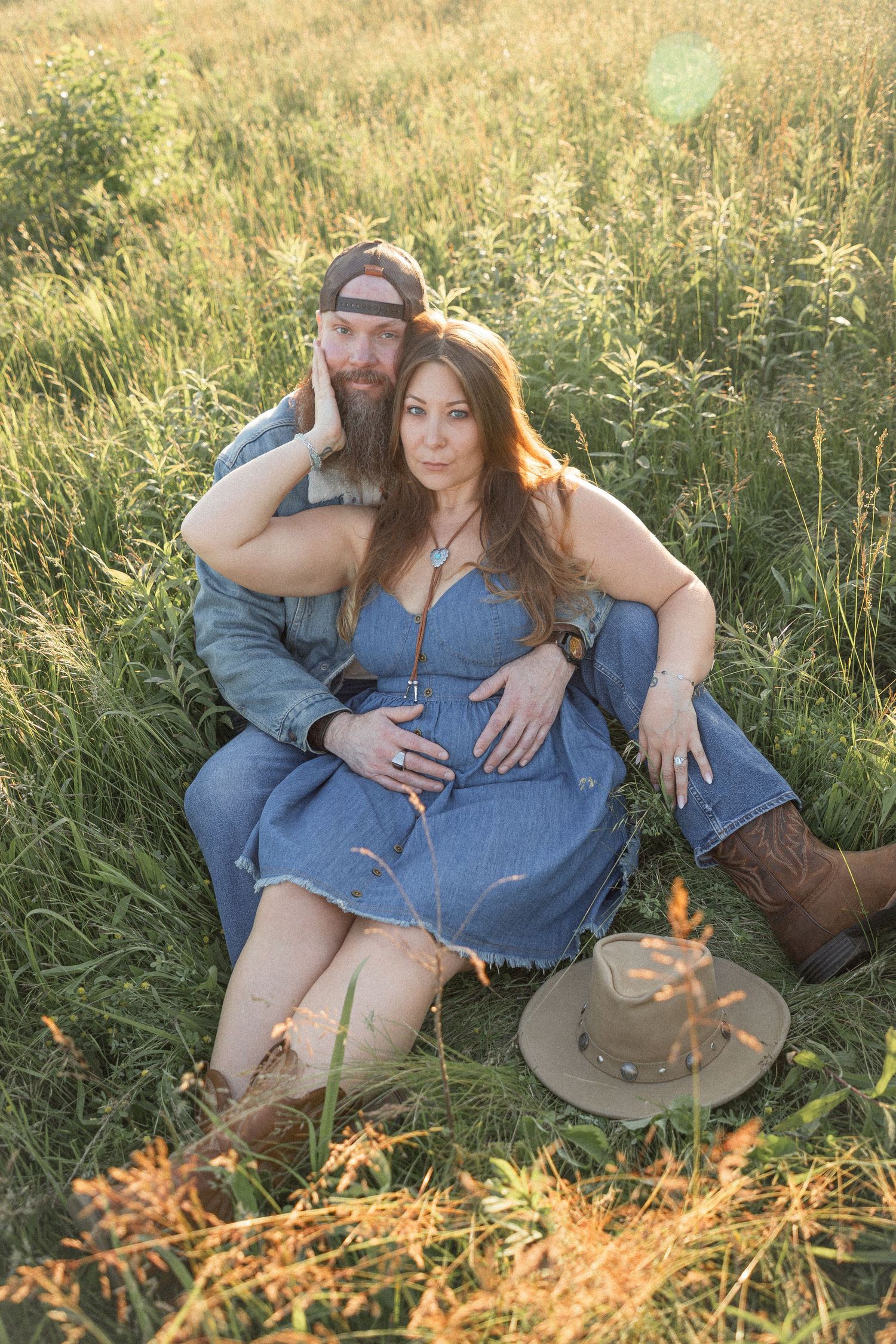 Ohio wedding photographer - Adeva Rae Photography - Couple in field with hills - western attire.