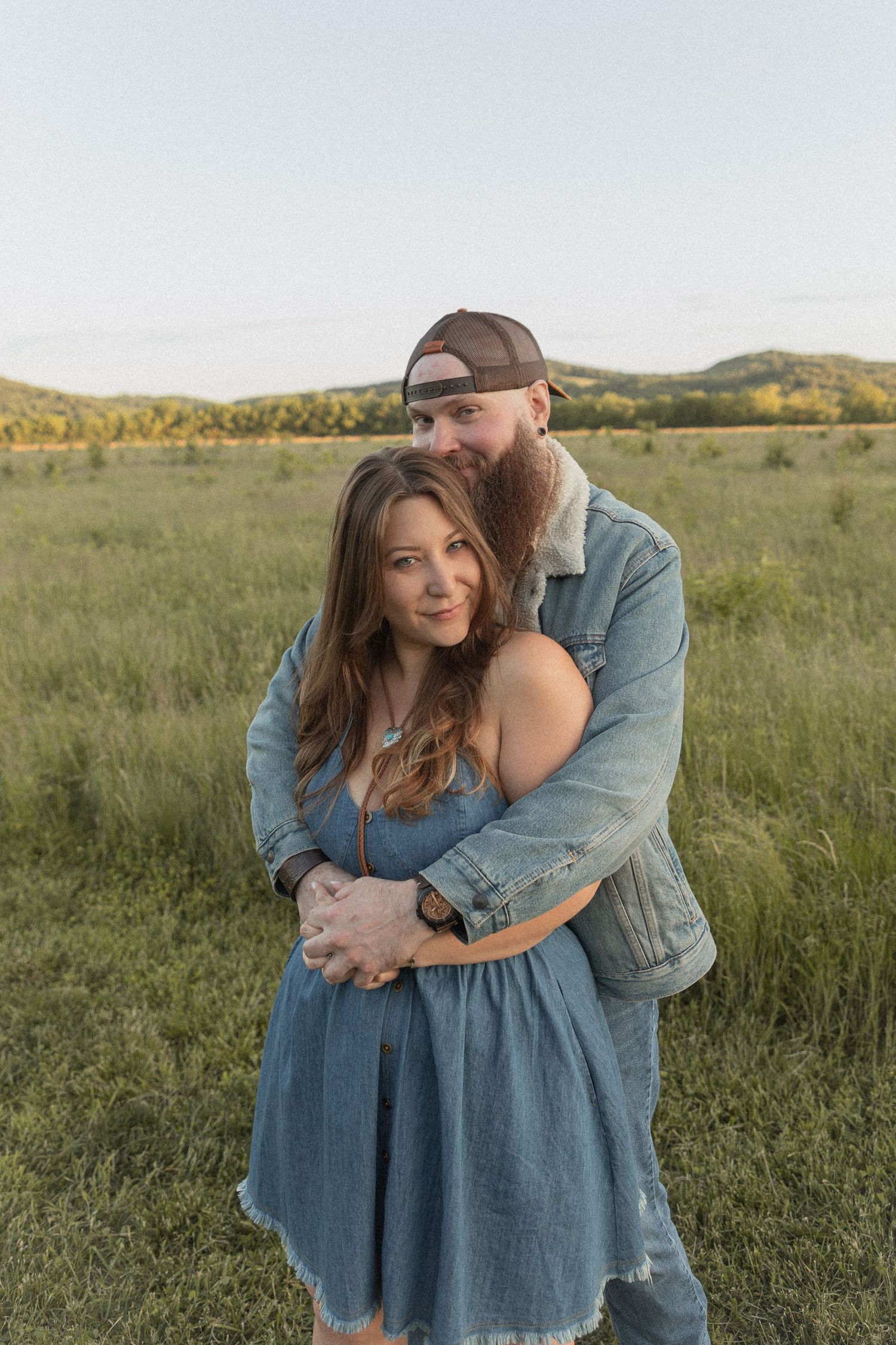 Ohio wedding photographer - Adeva Rae Photography - Couple in field with hills - western attire.