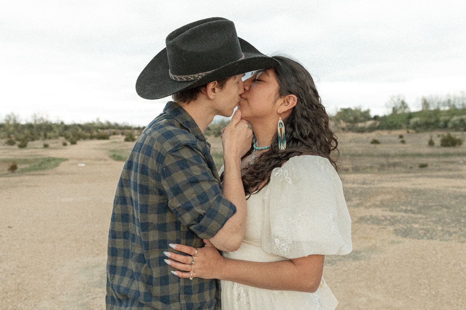 Ohio wedding photographer - Adeva Rae Photography - CoupleOhio wedding photographer - Adeva Rae Photog in field with hills - western attire.