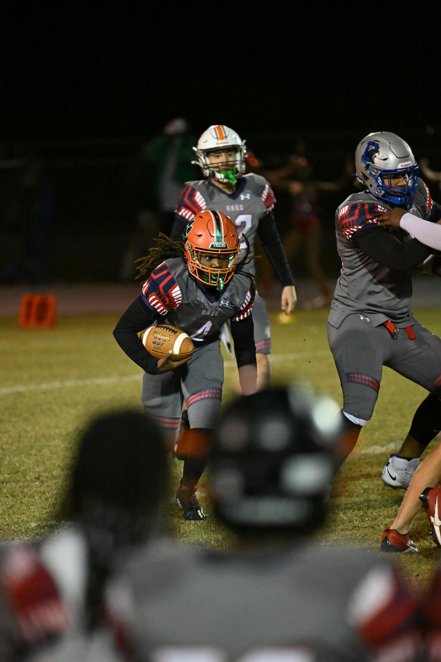 Running back dodging tackles during Allstar game at Nova high school field - Broward County Sports photographer