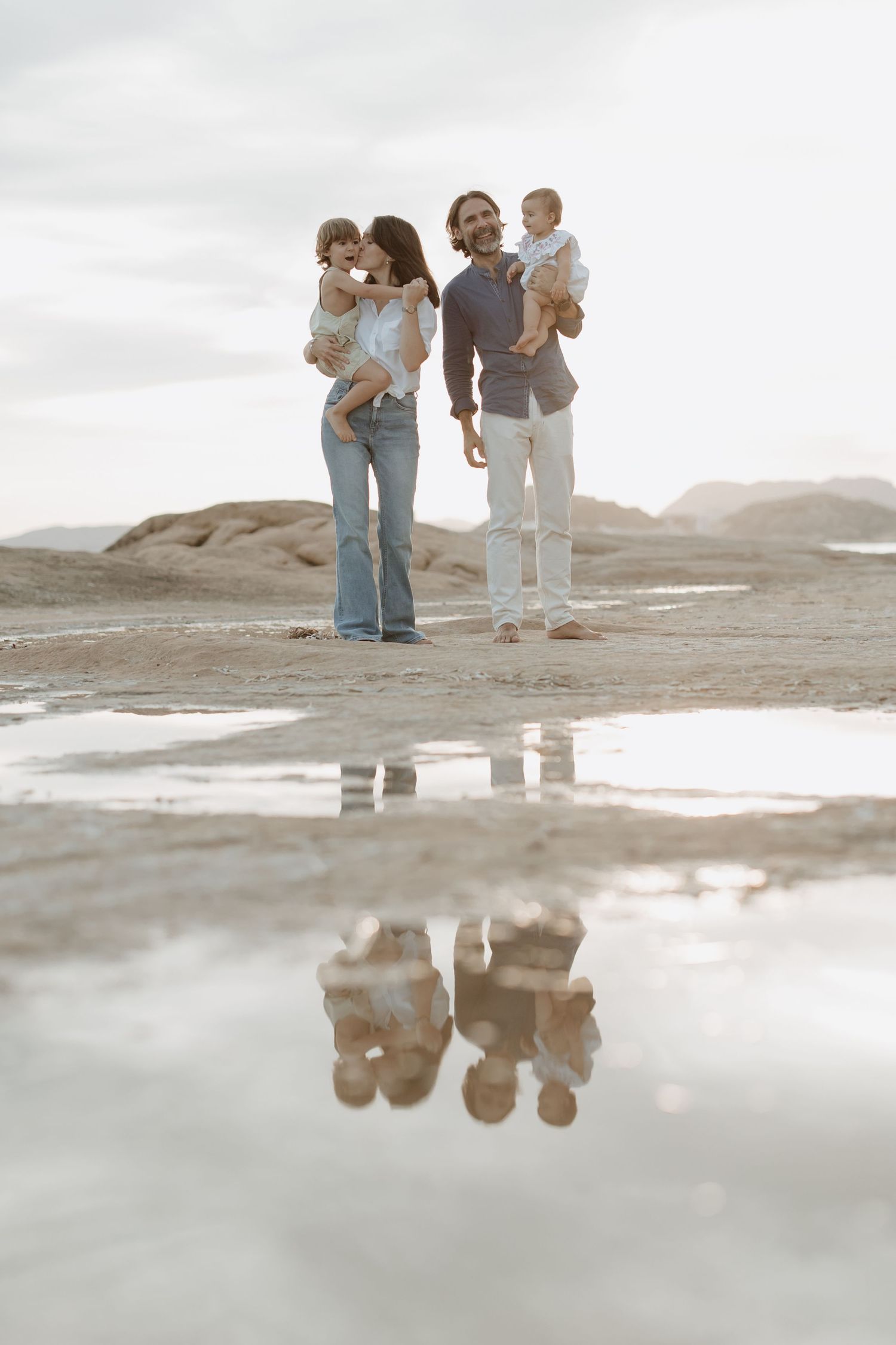 Group portrait with beautiful reflections in tide pools along rocky shore.
