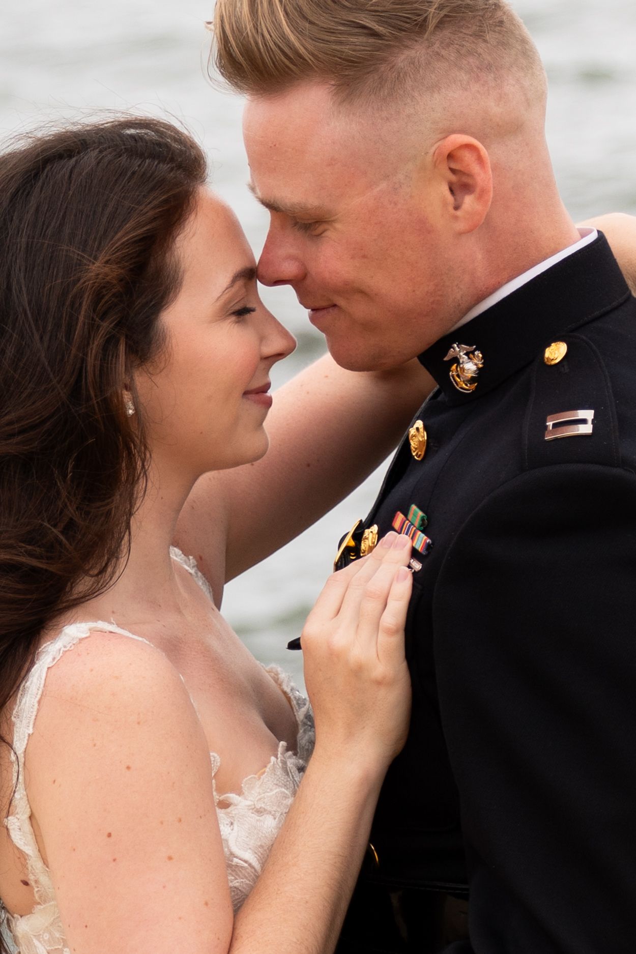 A romantic wedding photoshoot series showing tender moments between a bride in white and a groom in military dress uniform.