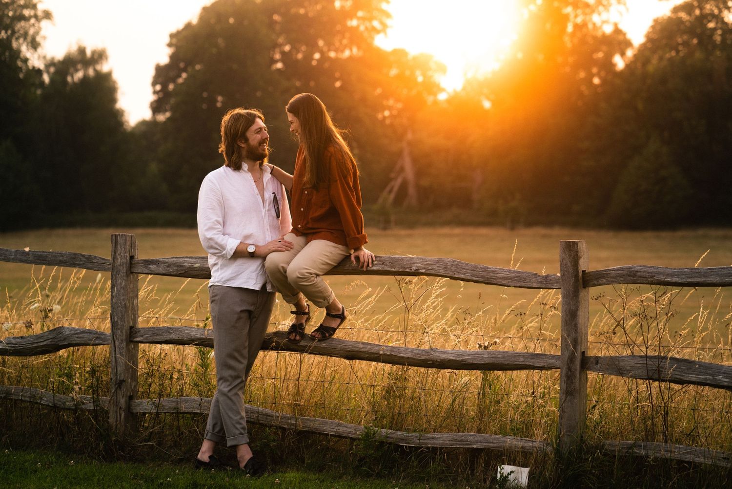 couple in field during golden hour