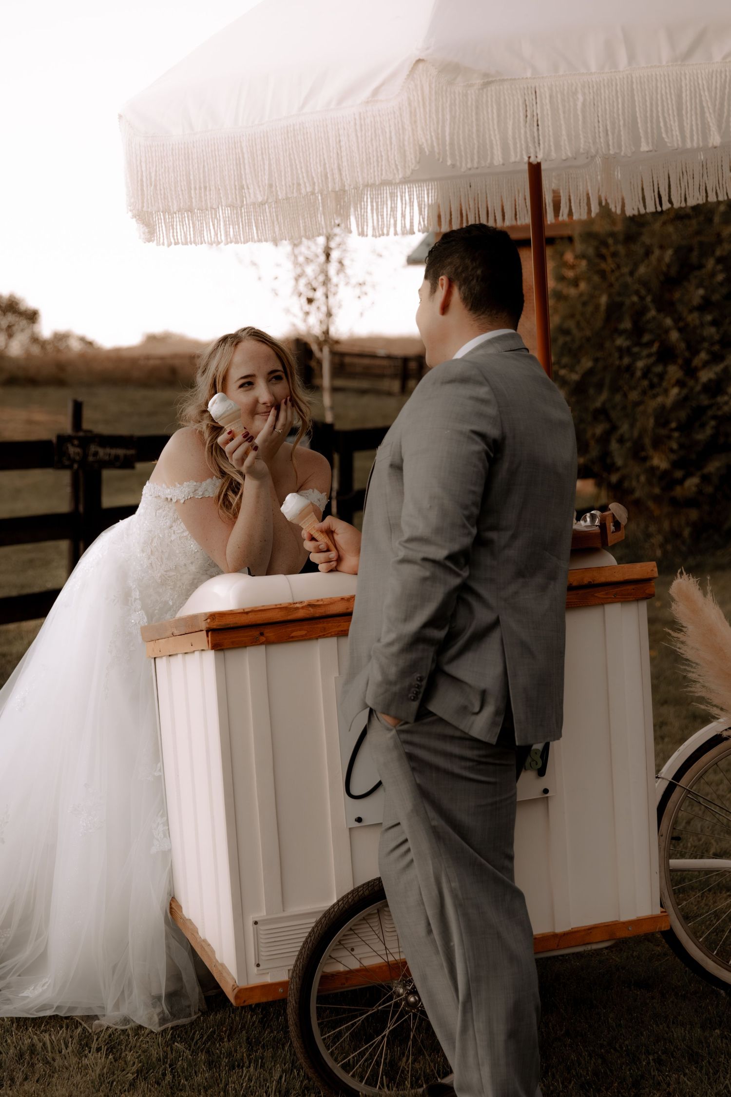 A romantic scene at a vintage food cart with a white parasol umbrella.