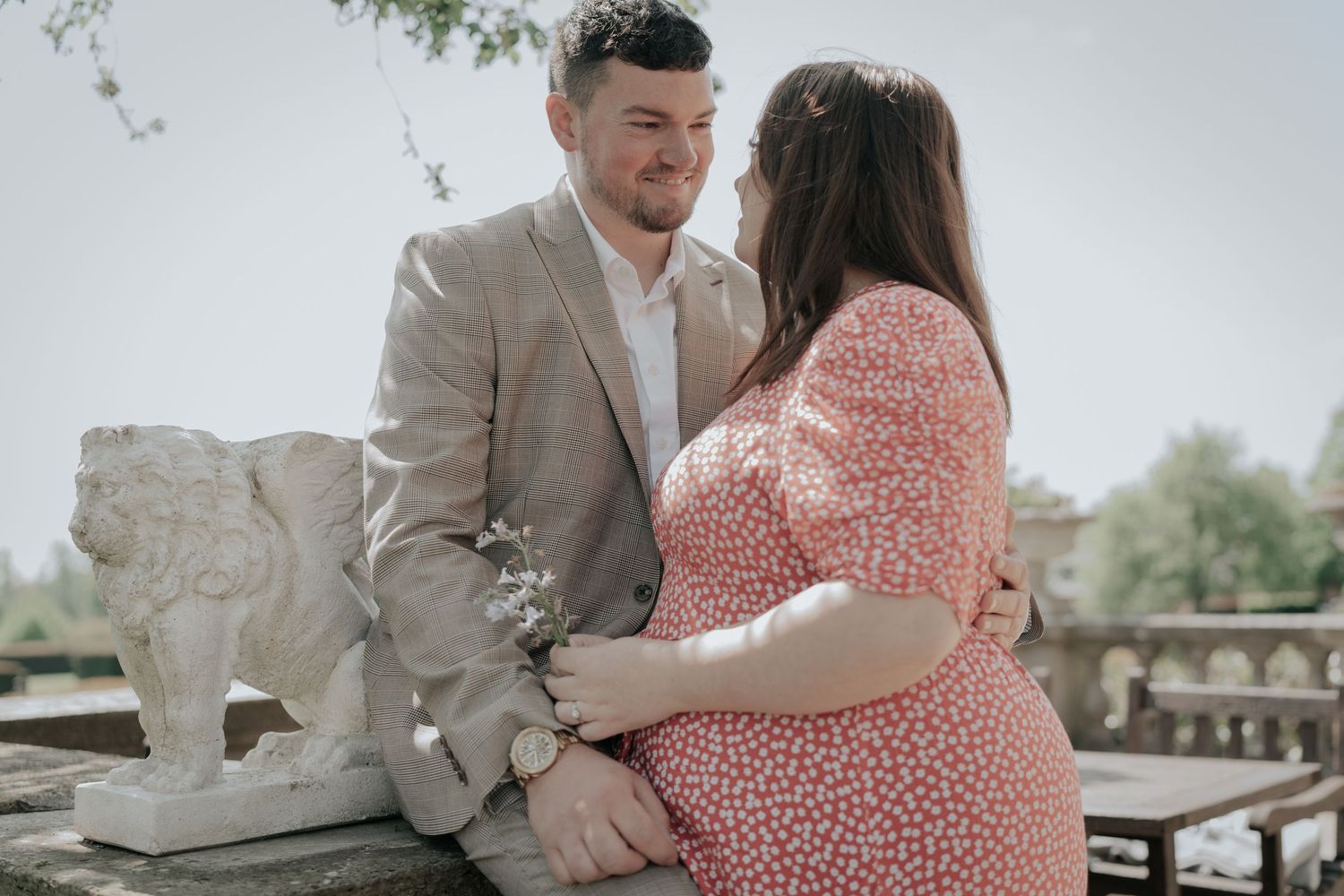 Sweet engagement photos in soft lighting with coral and beige color palette.