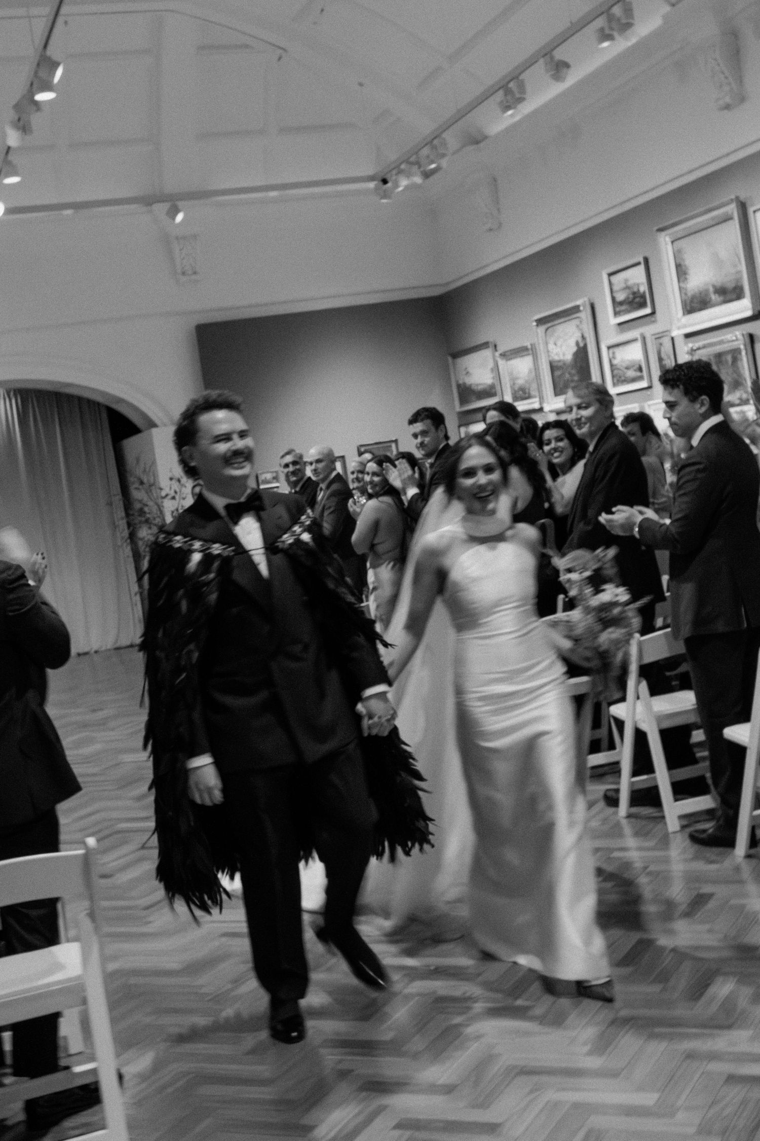 Black and white photo series showing a bride and groom twirling and dancing together at their wedding reception.