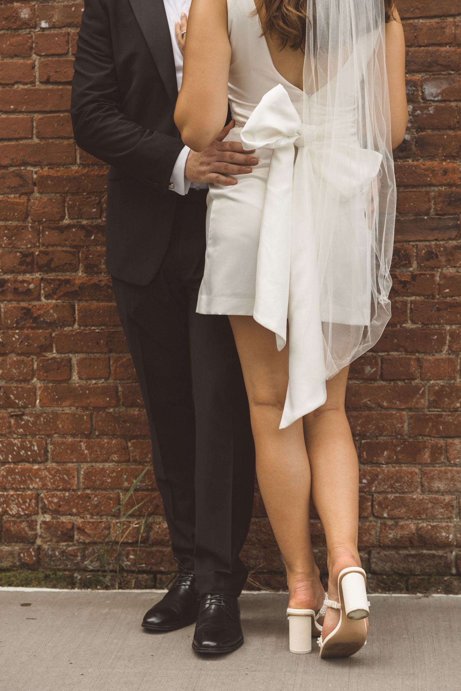 Elopement portrait of couple in DUMBO with historic brick architecture