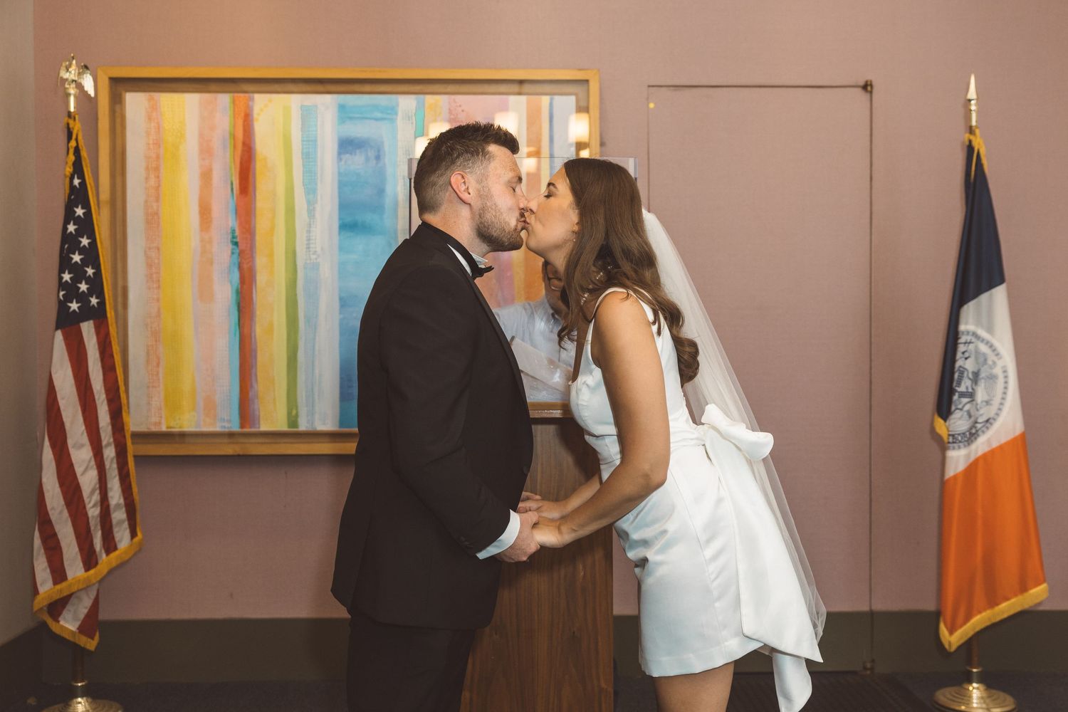 Bride and groom exchanging vows at New York City Hall during courthouse elopement