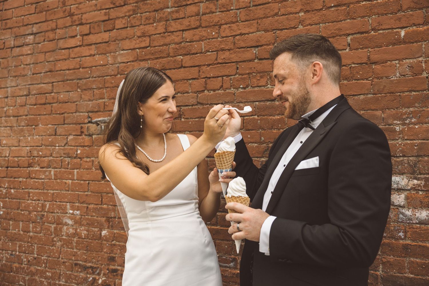 UK couple sharing ice cream during their NYC elopement day