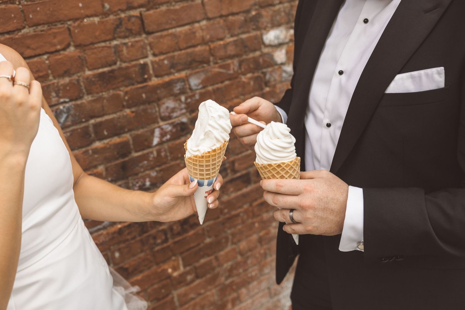 Romantic and fun elopement photo of UK couple eating ice cream in Brooklyn