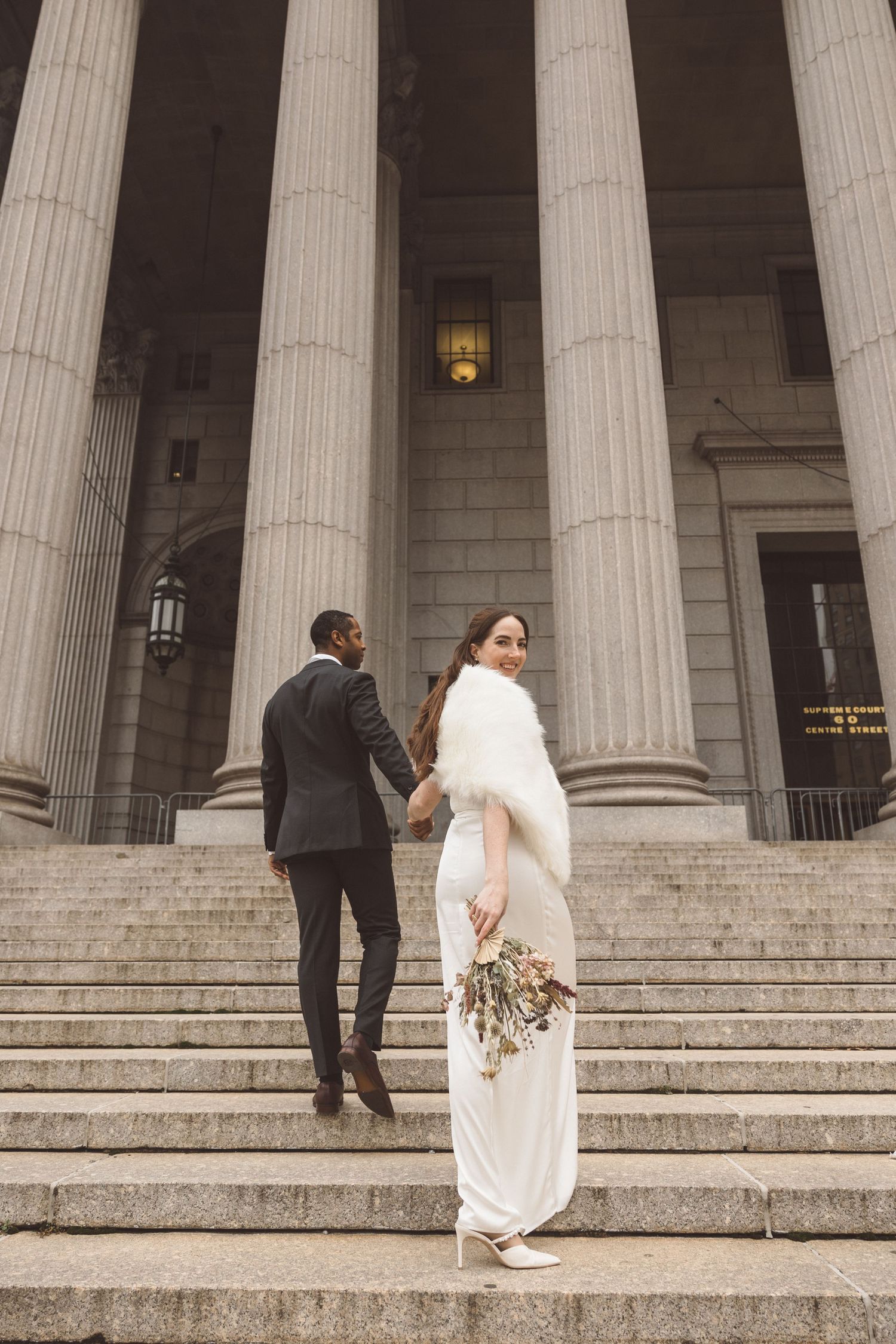 Intimate wedding moment on the steps of the Manhattan City Clerk’s Office