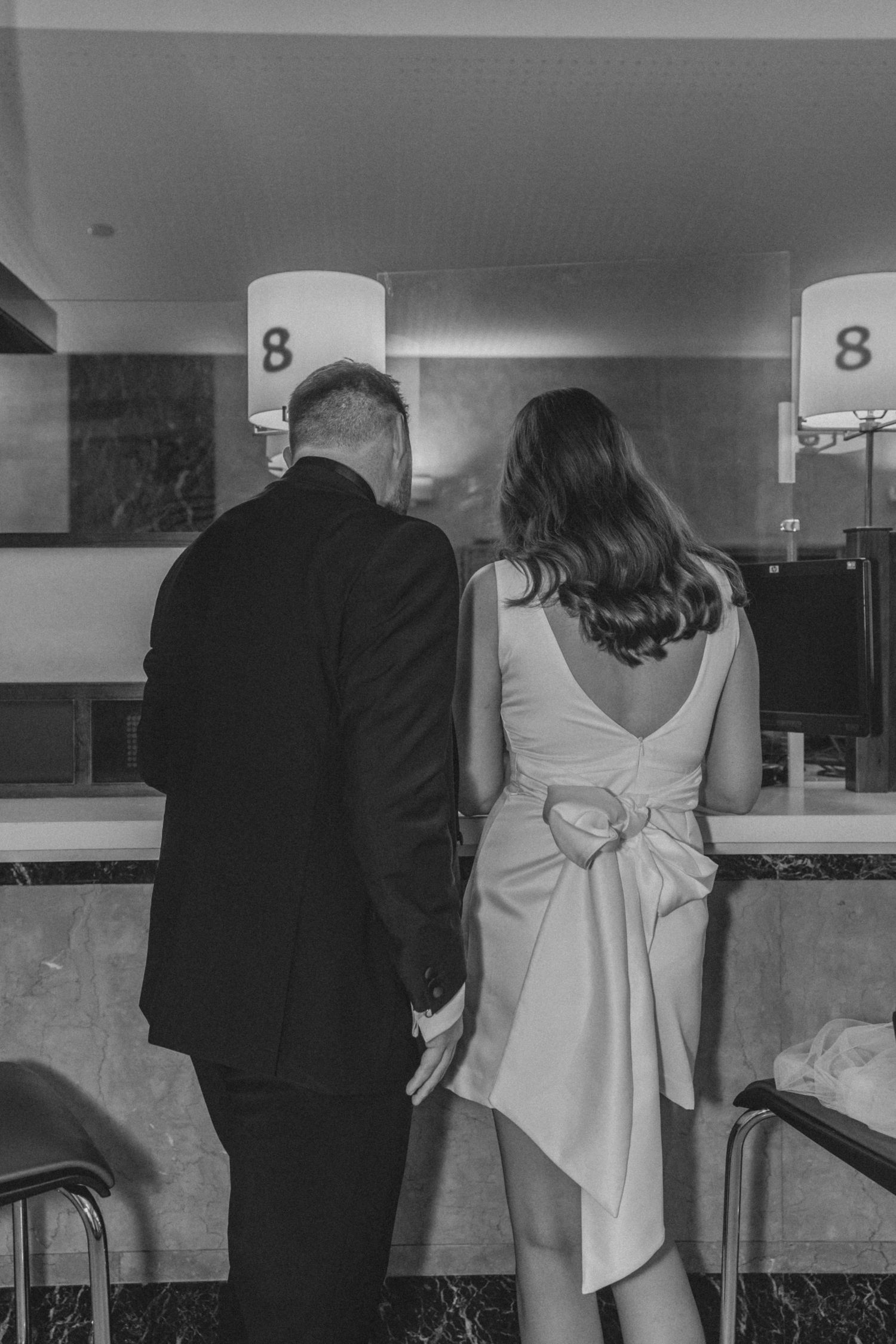 UK couple signing marriage certificate during NYC City Hall wedding