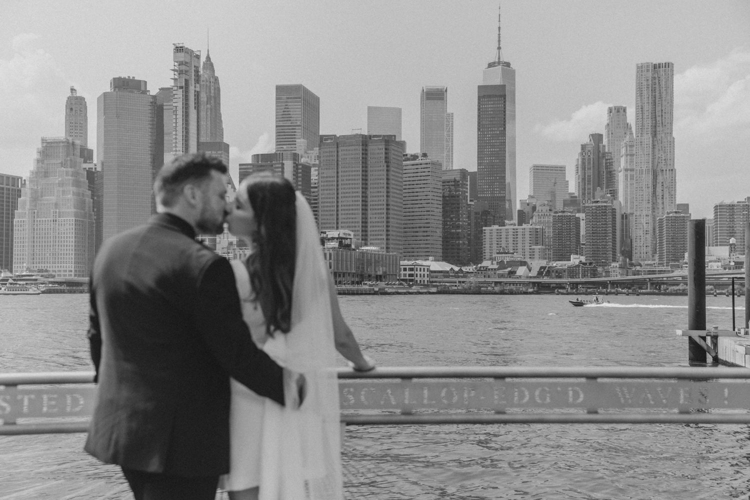 Stylish couple enjoying skyline views after NYC courthouse wedding