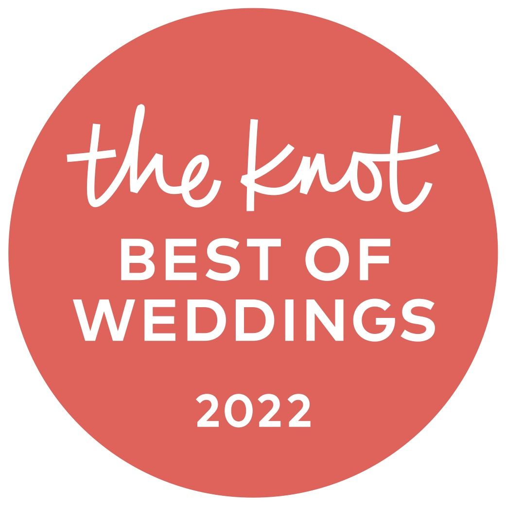 The Knot Best of Weddings 2022 logo in white text on a coral red circular background.