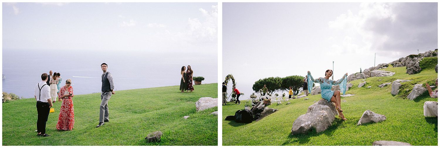 People enjoying a scenic picnic and outdoor activities on a grassy hilltop overlooking the ocean.
