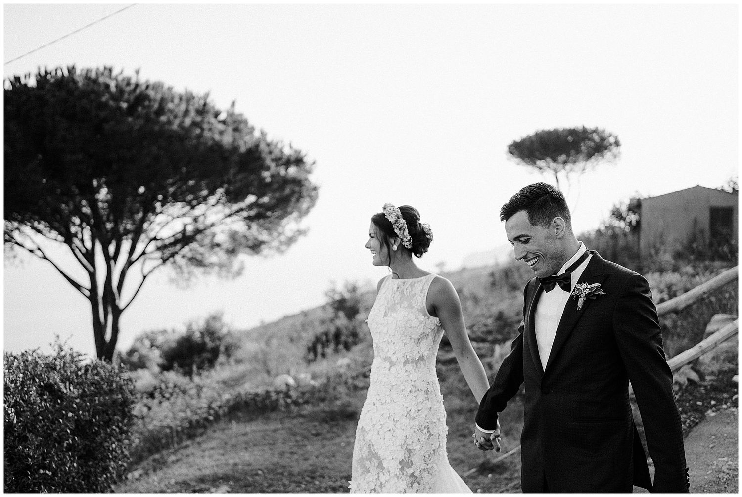 A series of black and white wedding photographs showing romantic moments between a couple in an outdoor setting.