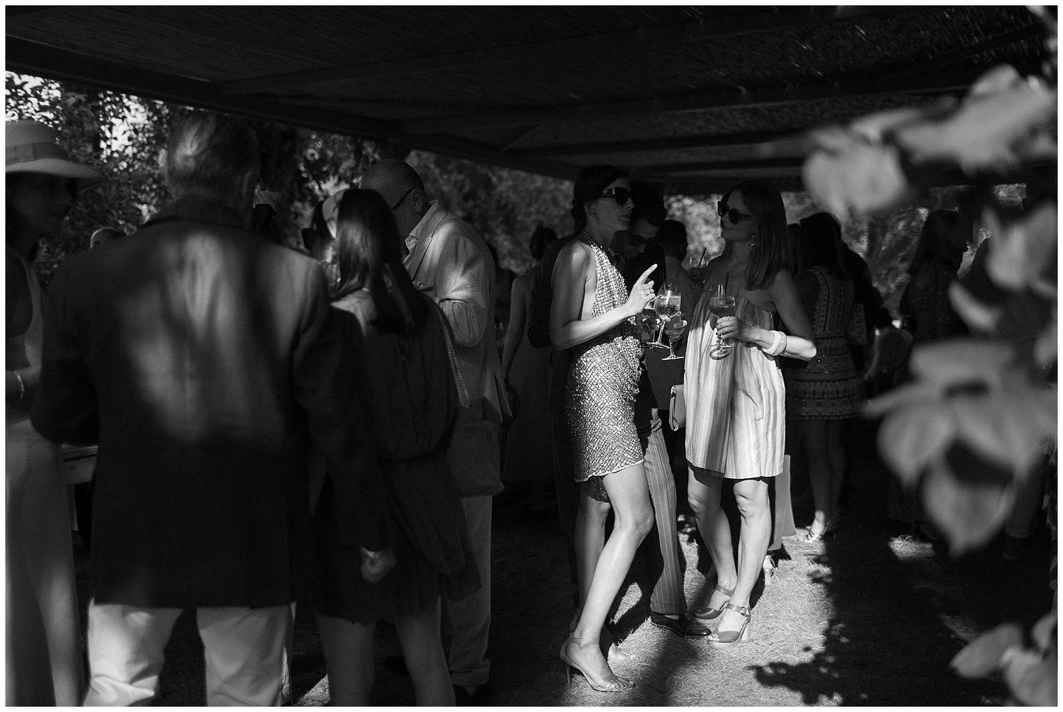 A black and white time-lapse collage showing multiple moments from a wedding couple's first dance on the dance floor.