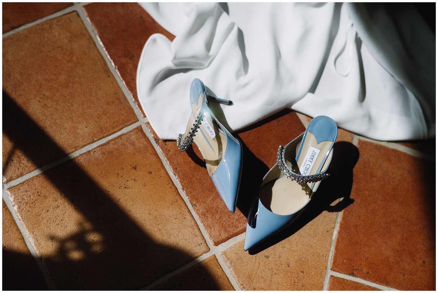 Multiple close-up frames showing white sneakers walking across orange-tinted floor tiles in diagonal composition.
