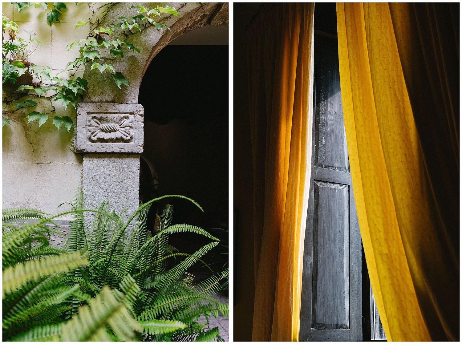 A stone architectural detail on stucco wall next to plants and a window with mustard yellow curtains.