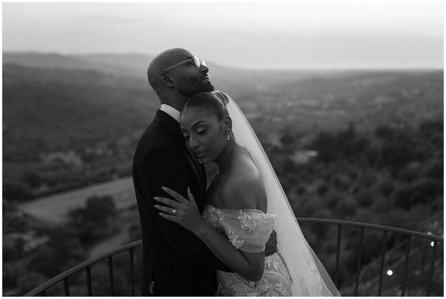 A collection of black and white scenic wedding photographs showing romantic moments against a mountainous landscape.
