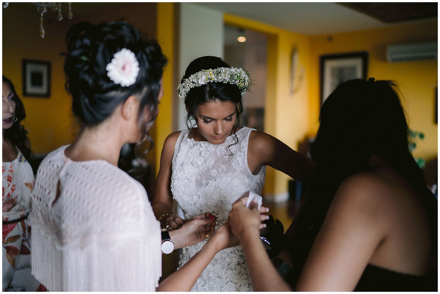 A series of candid moments from a wedding celebration showing people dancing and interacting in an indoor venue.