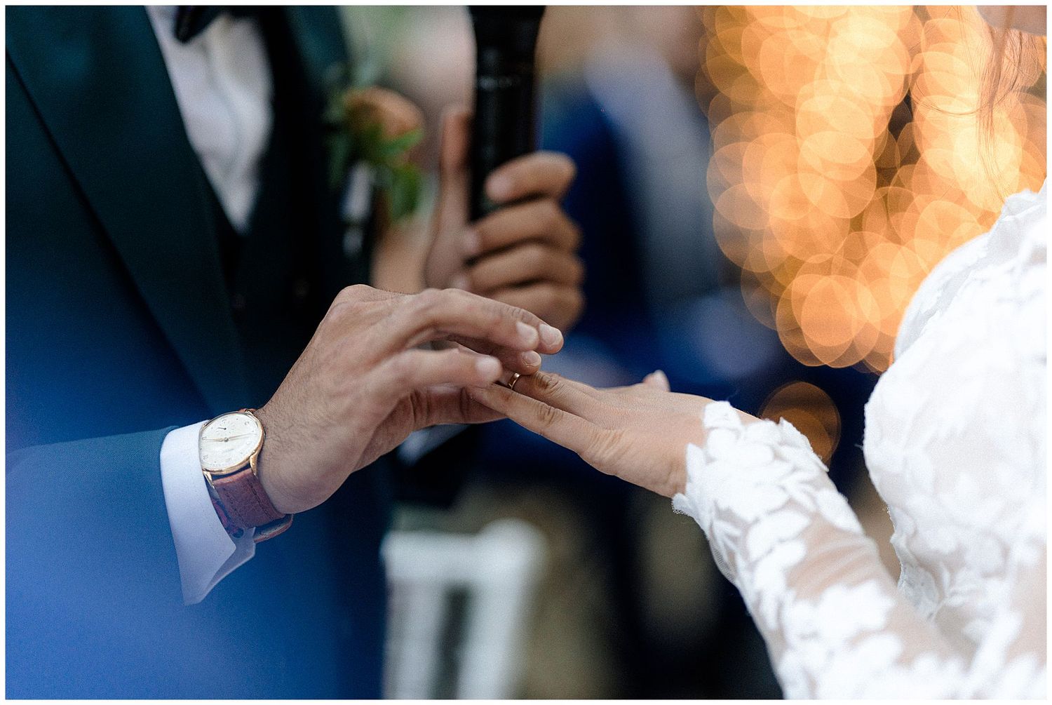 Close-up candid moments from an evening wedding reception with blurred bokeh lighting.