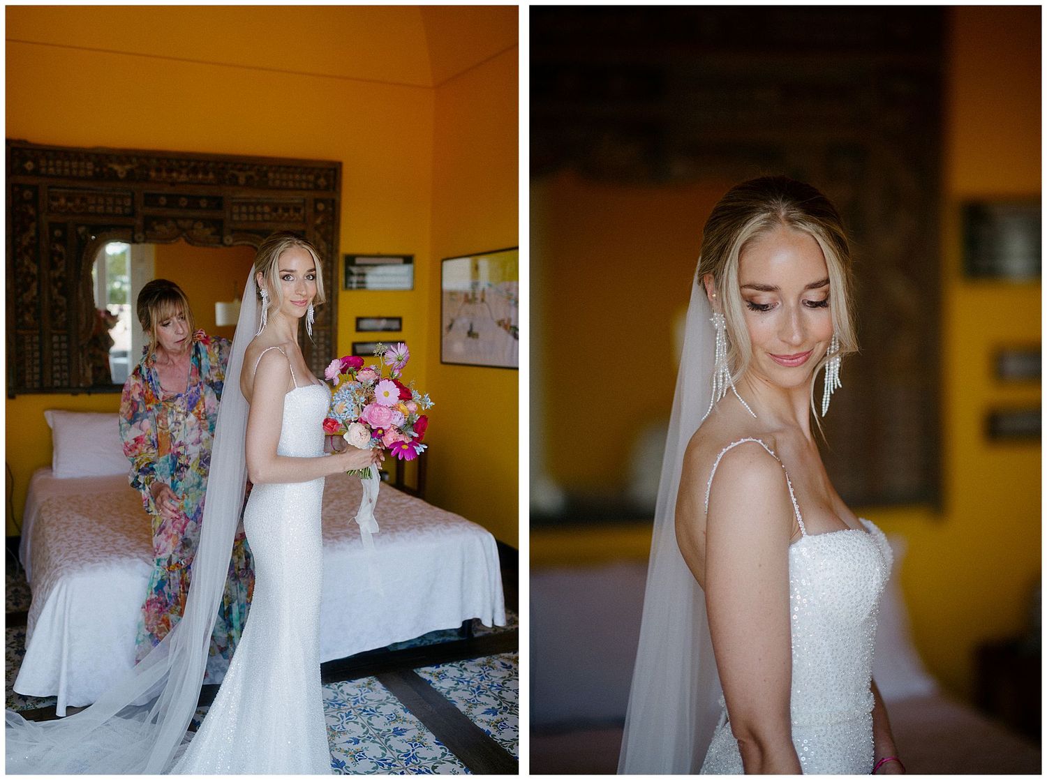 Bride in elegant white strapless wedding dress with long veil stands in bridal suite with warm lighting and decor.