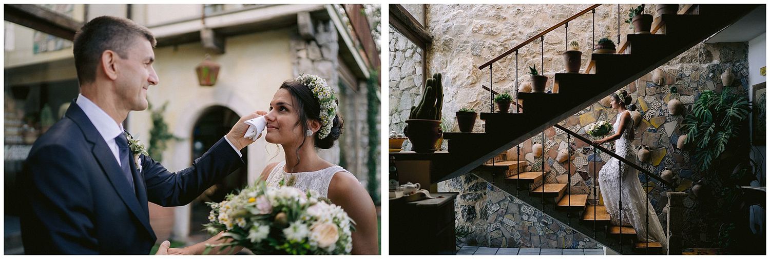 Wedding party ascending rustic wooden staircase in dramatic lighting.