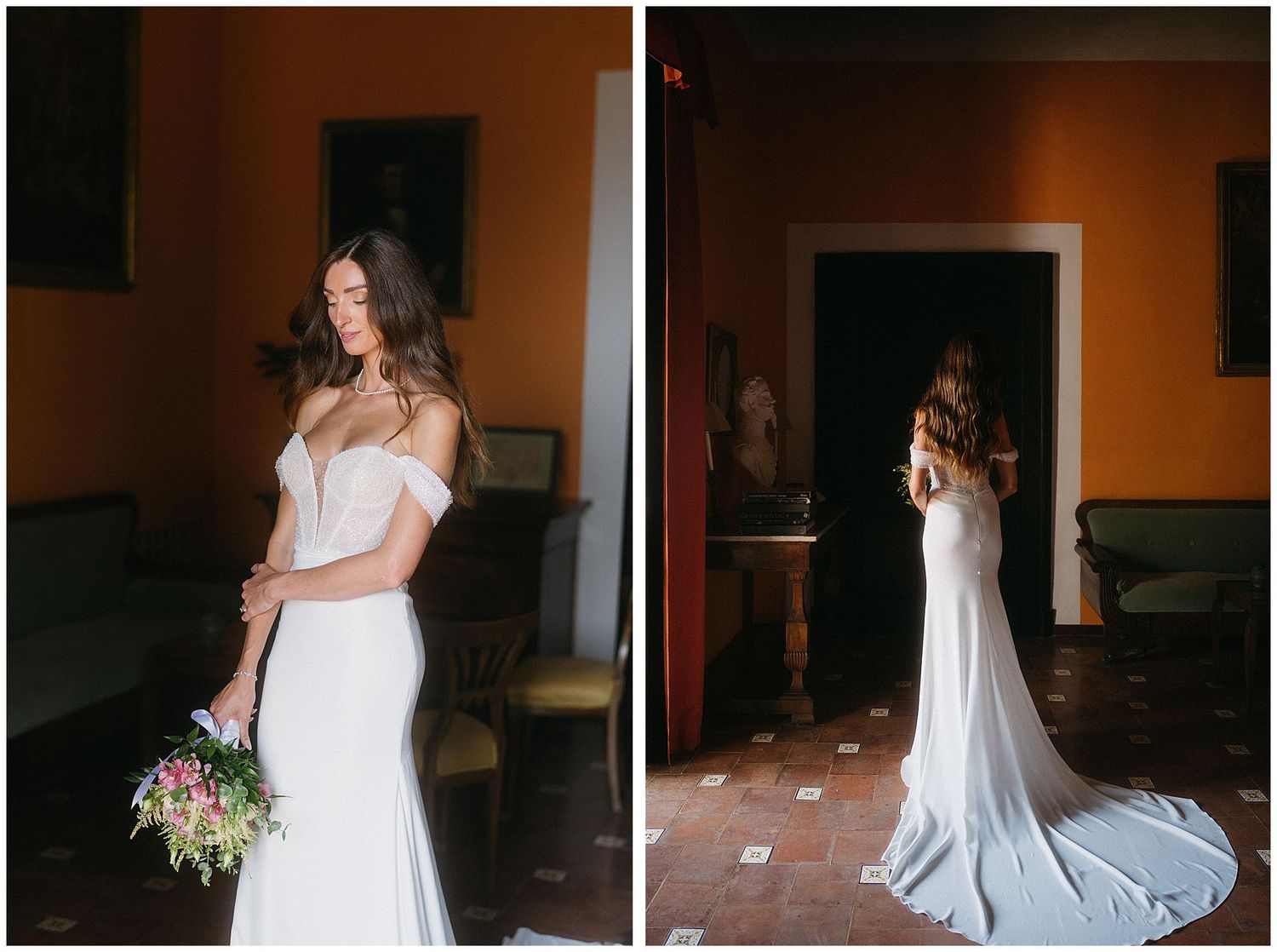 Person in a flowing white wedding gown holding a colorful bouquet poses elegantly in a warmly lit room.