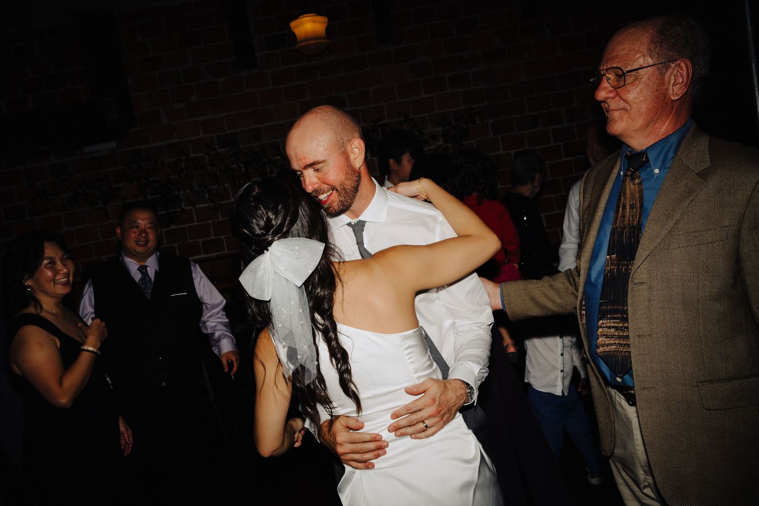 Wedding couple sharing intimate dance moment at reception.