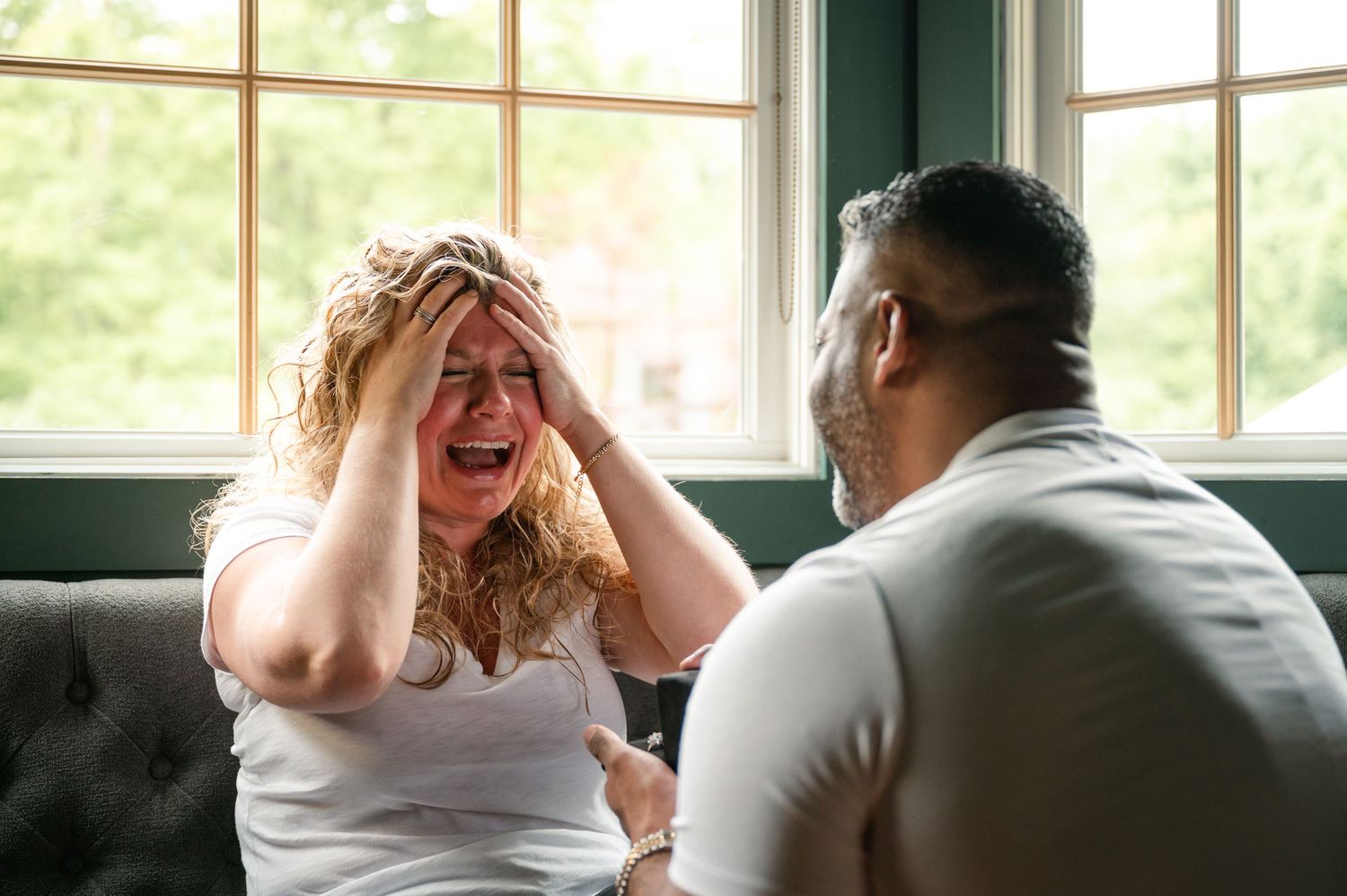 A sequence of joyful candid moments captured through windows showing natural light and laughter.