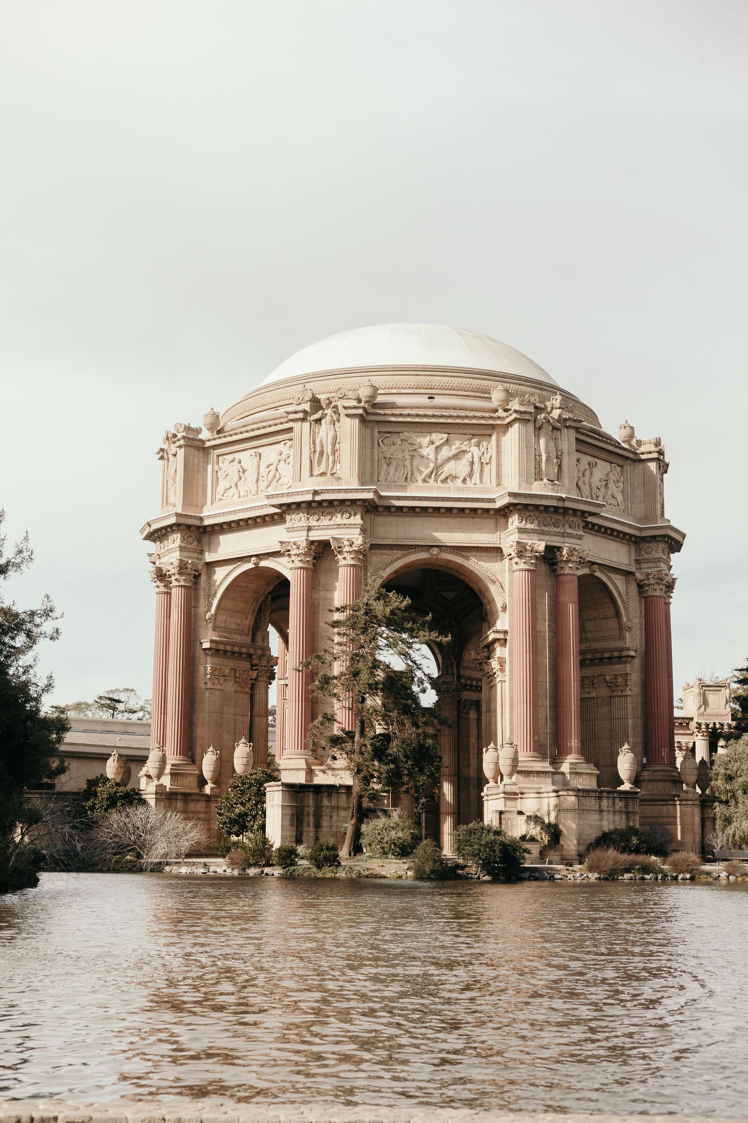 The Palace of Fine Arts features a grand domed rotunda reflected in still waters in San Francisco, California.