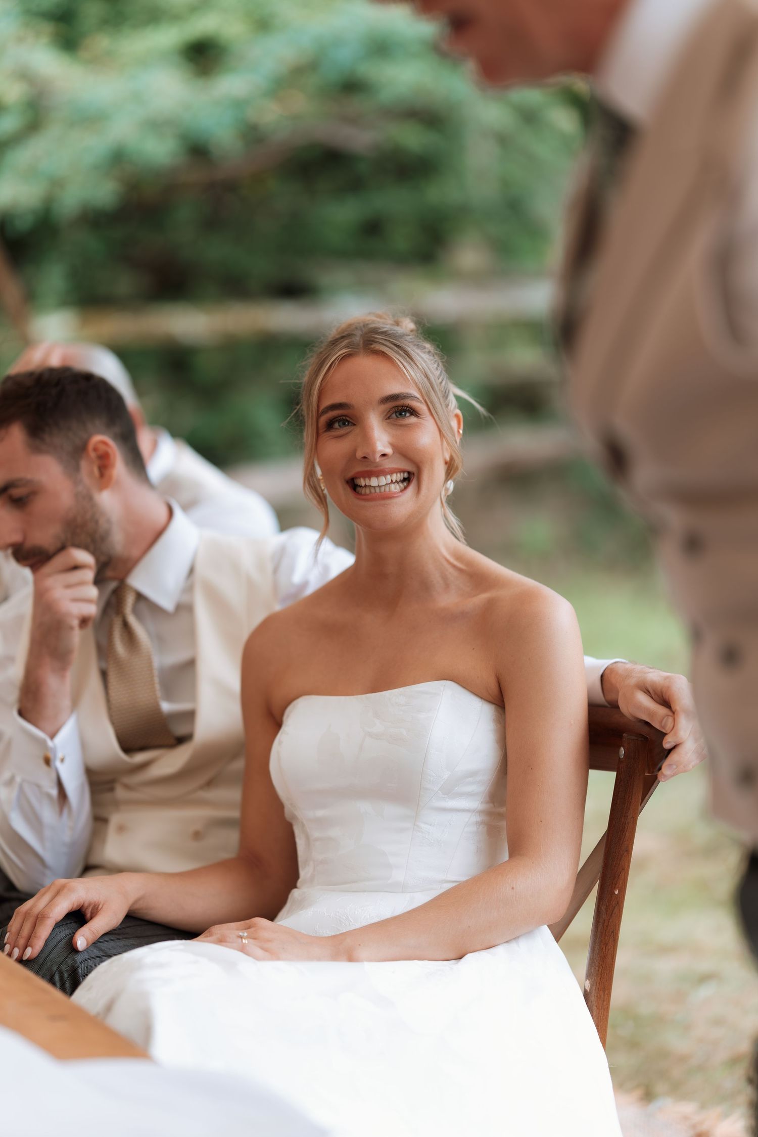 A candid moment of joy captured during the wedding reception festivities.