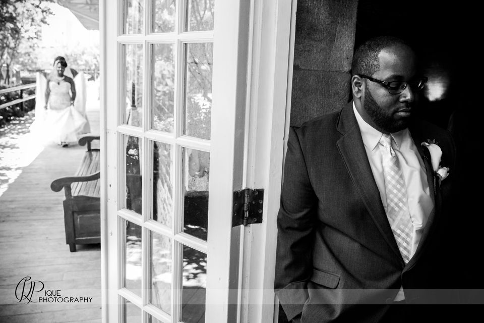 Artistic black and white wedding photography through window panes.