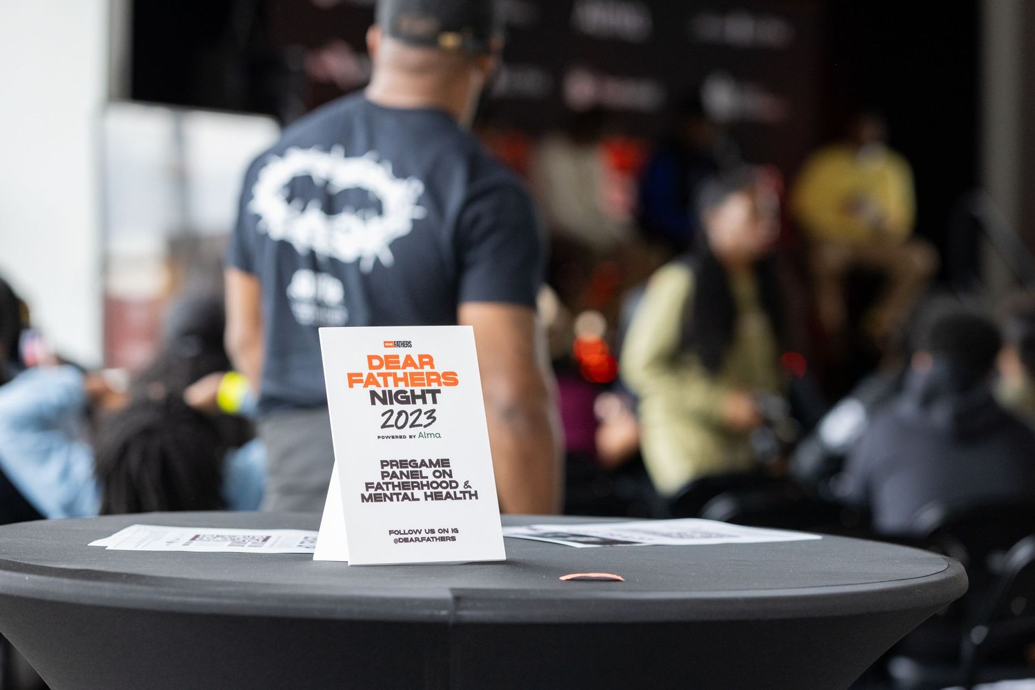 Close-up of promotional product package on table at marketing event.