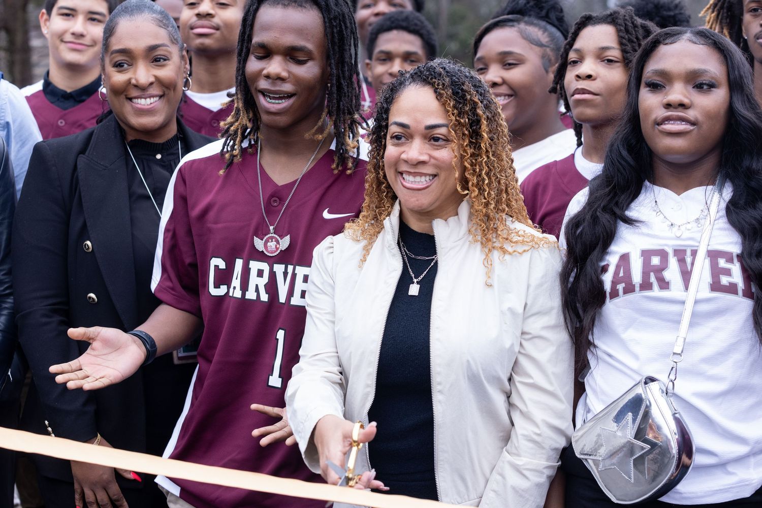 Group of students and school staff gathered together for a community event.