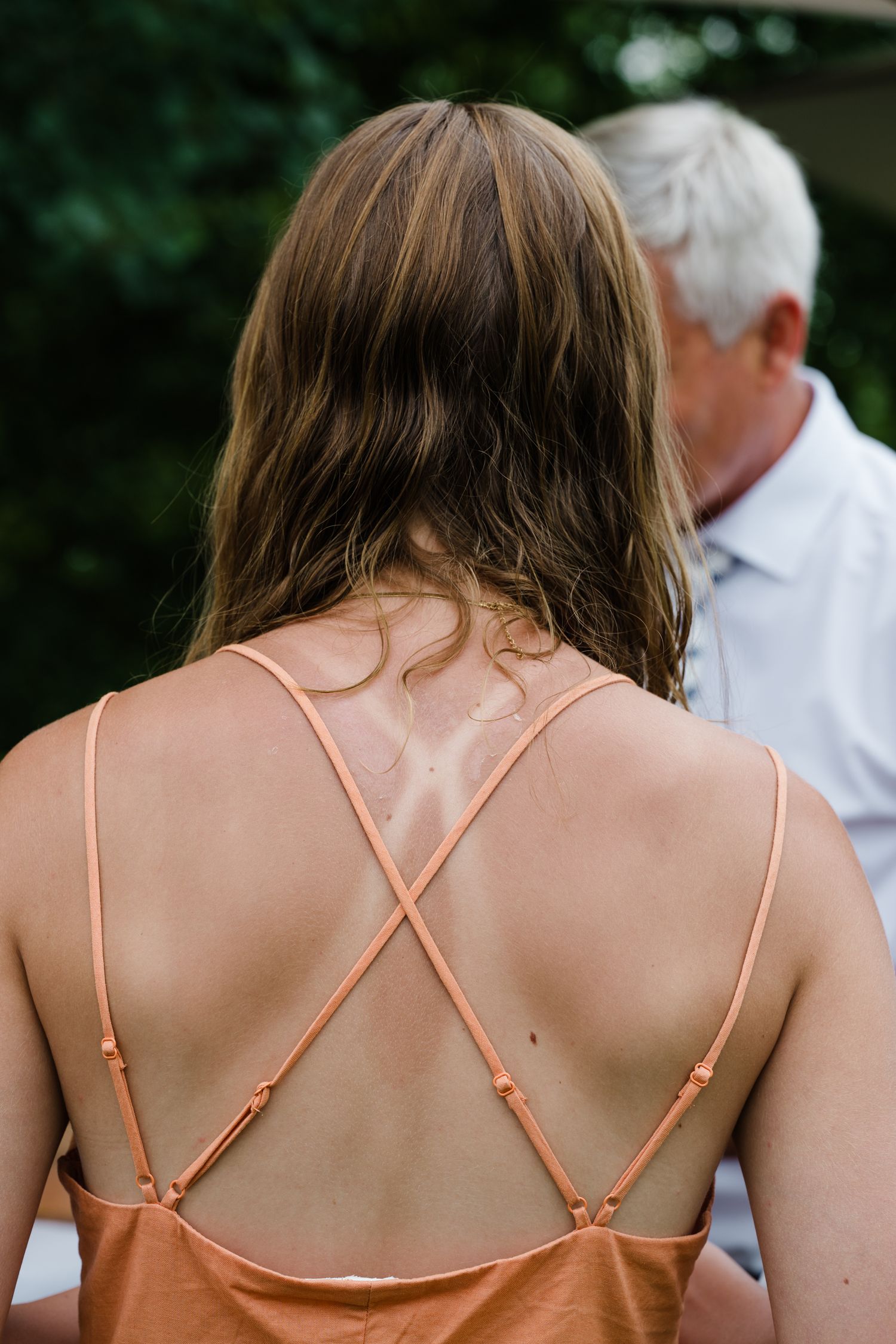 Wedding guest with tan lines